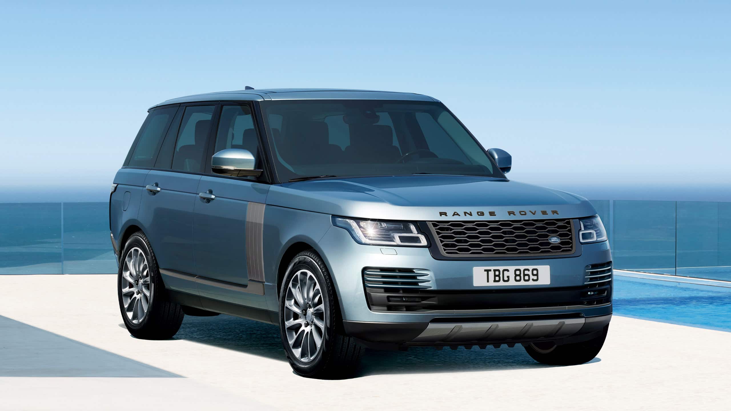 Parked Range Rover outside of glass area