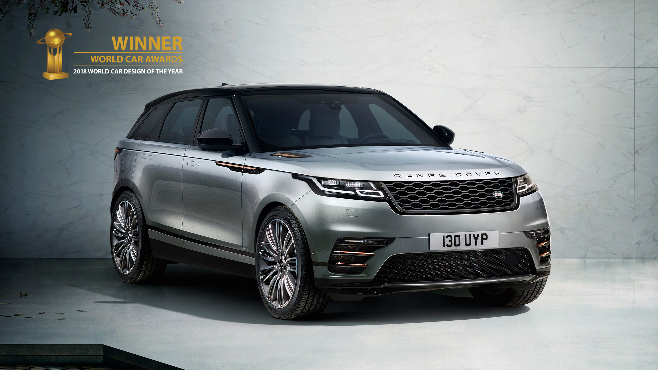 Parked Range Rover In Classic Showroom with Winner trophy logo